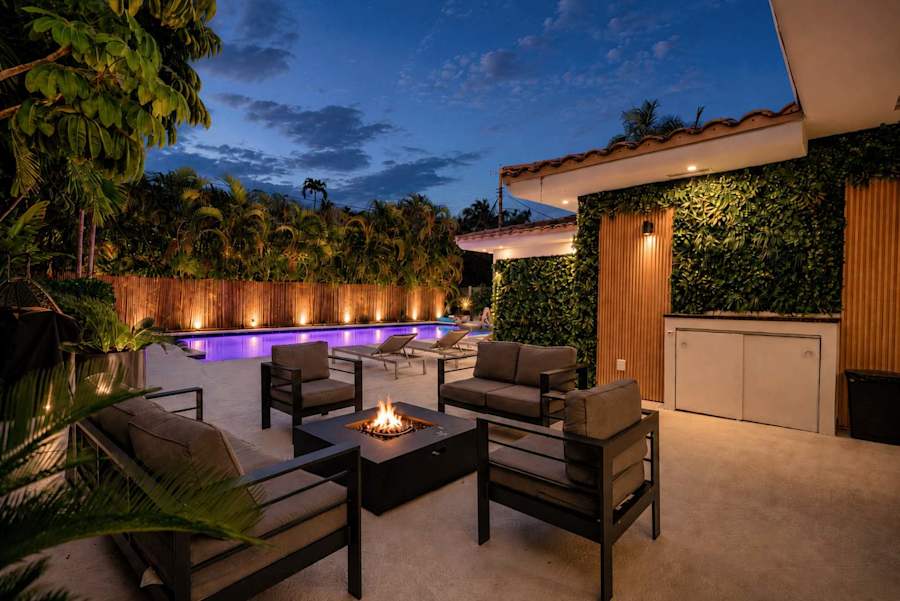Miami Luxury Access private villa with heated pool and fire pit at dusk